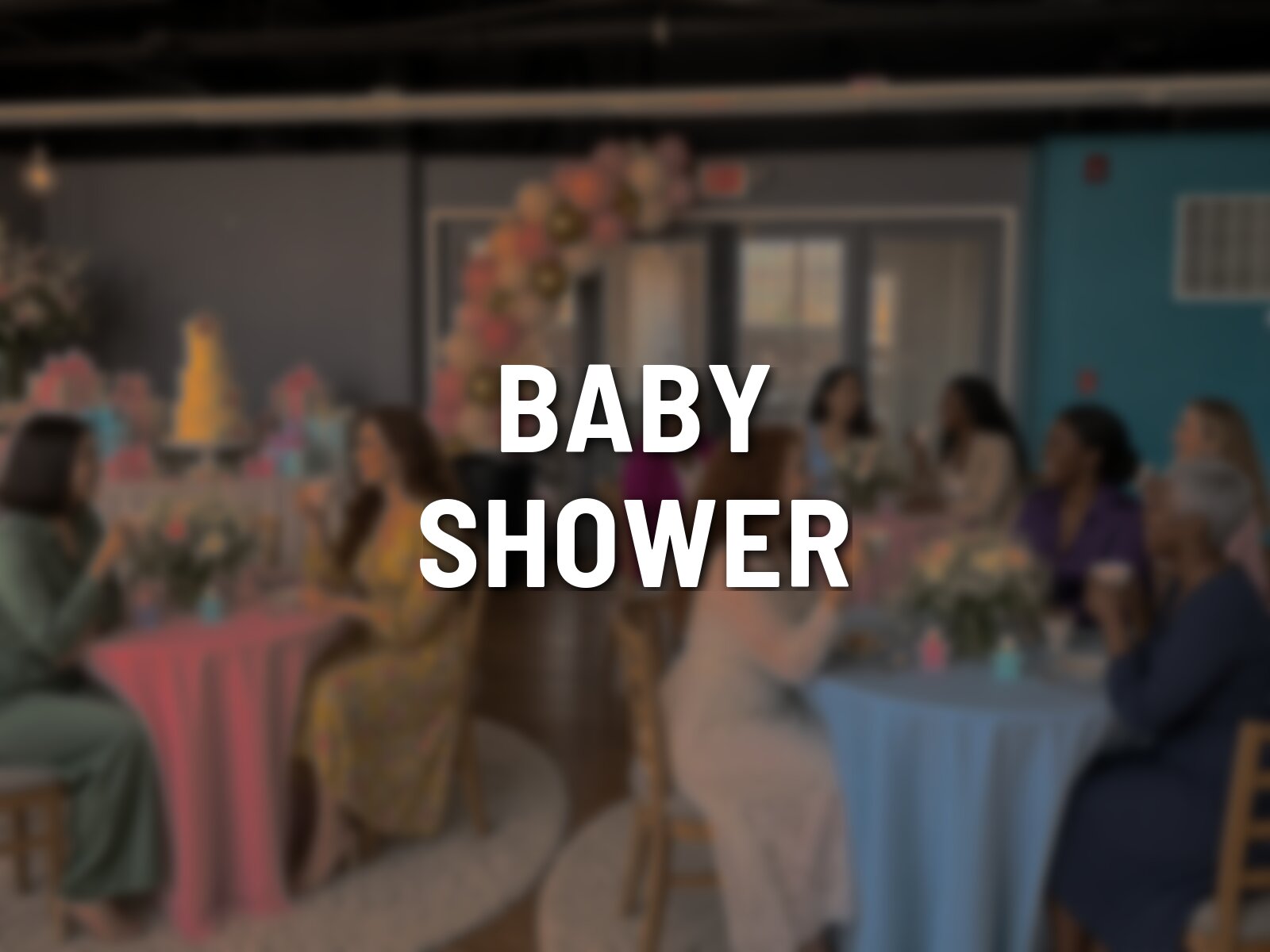 Example of a baby shower in the foyer at Pleasant Street Hall, round tables in pink and blue, a gift and cake table, and a balloon arch by the glass doors